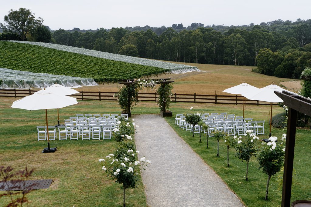 Outdoor ceremony arrangement at Yarra Ranges Estate with elegant décor and natural green landscape